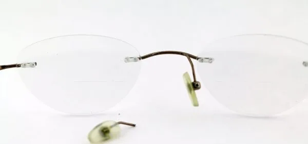 Rimless Eyeglasses' Left Nose Pad Arm Got Broken