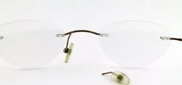 Rimless Eyeglasses' Right Nose Pad Arm Got Broken