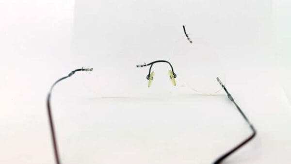 Rimless Titanium Eyeglass Left Bridge Weld