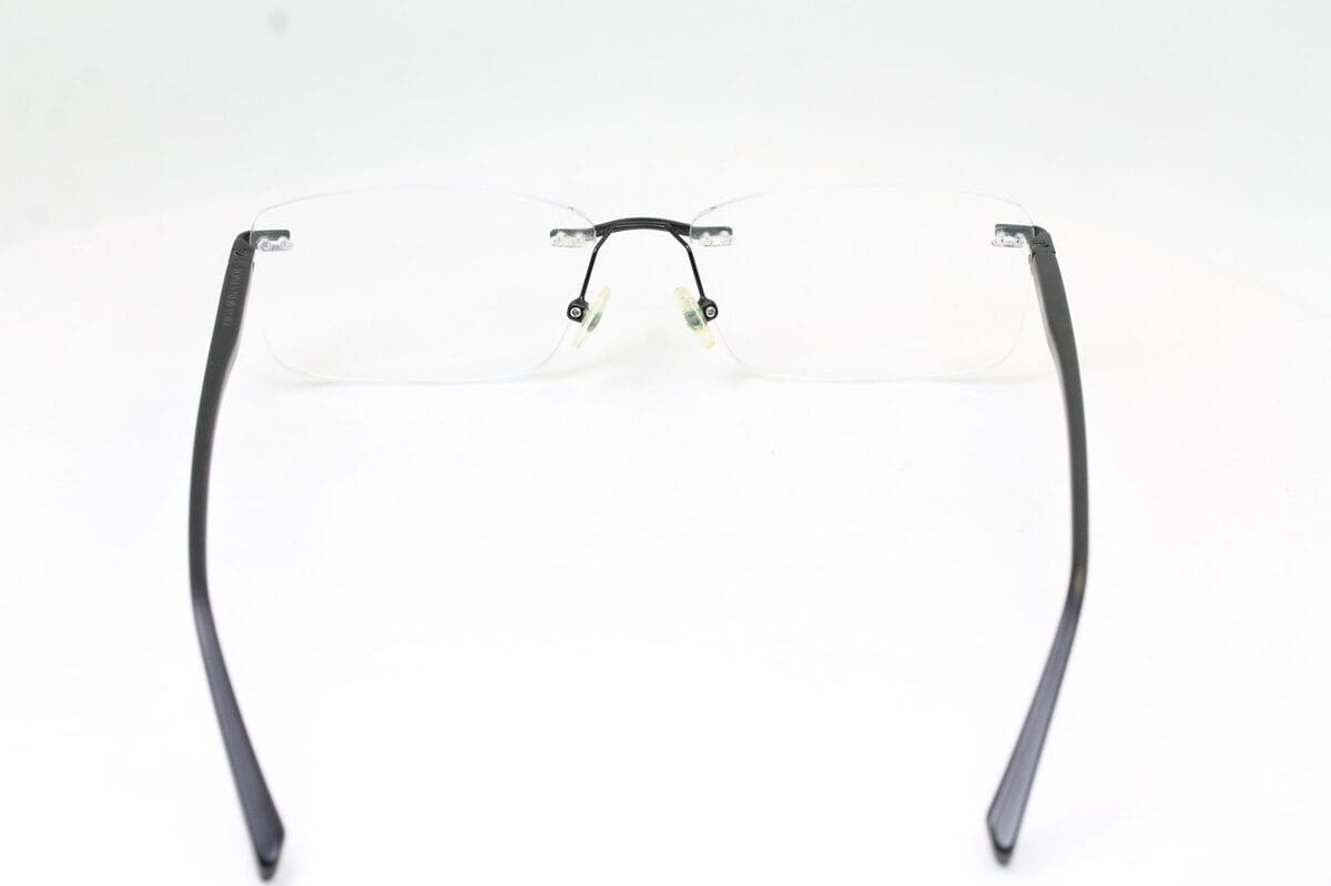 Repaired Jones New York rimless eyeglasses after laser-welding the right lens-mount post