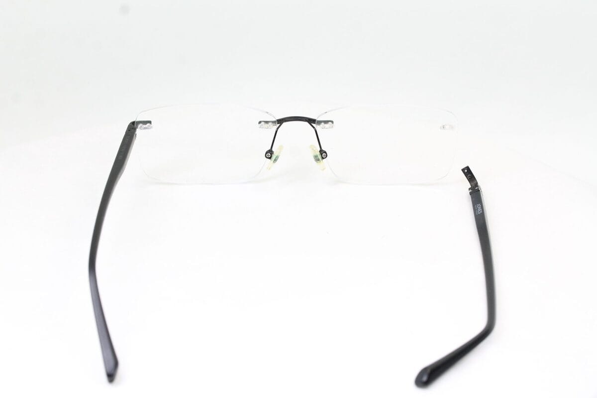 Jones New York rimless eyeglasses with a detached right temple, before repair